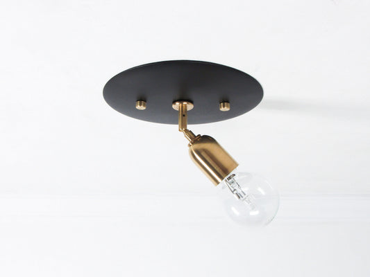 Adjustable Brass Flush Mount Disc Light - BLACK VERSION - SEEN ON THE CEILING