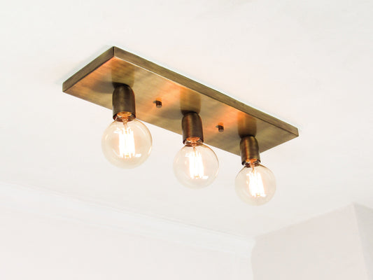 Antique Bronze Ceiling light fixture with three exposed bulbs