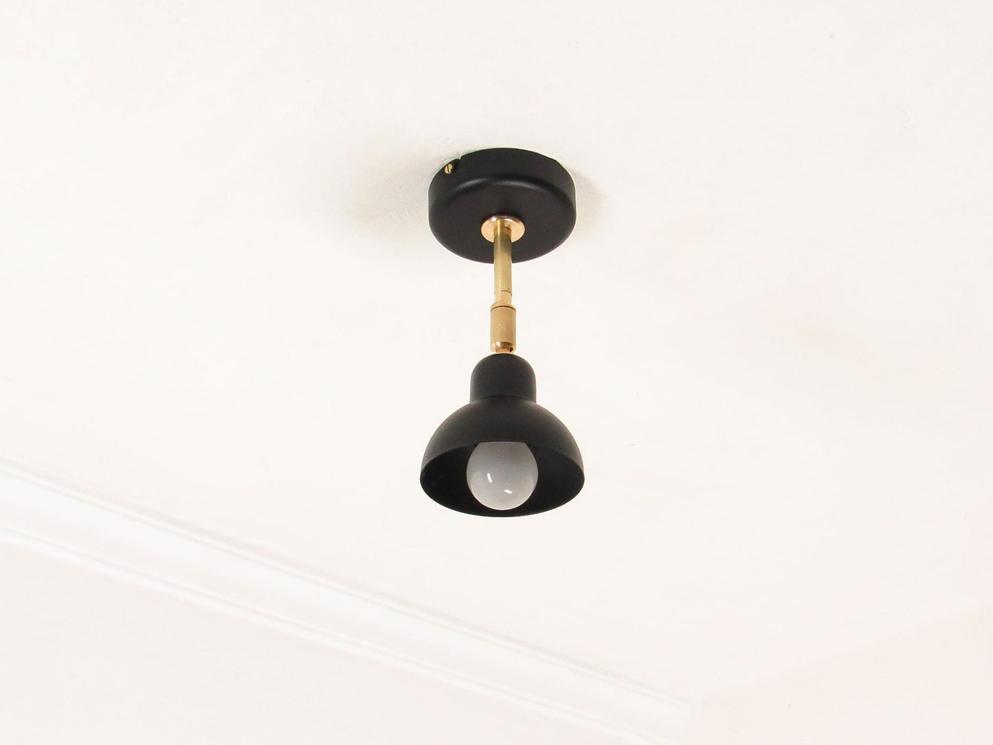 Black Brass ceiling light fixture on a white background