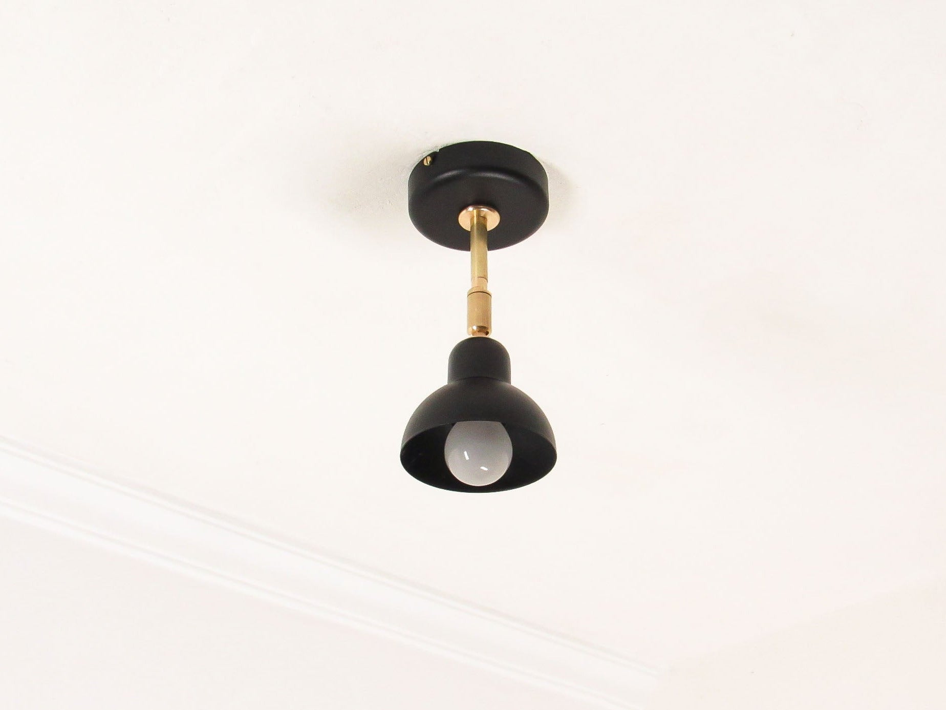 Black Brass ceiling light fixture on a white background